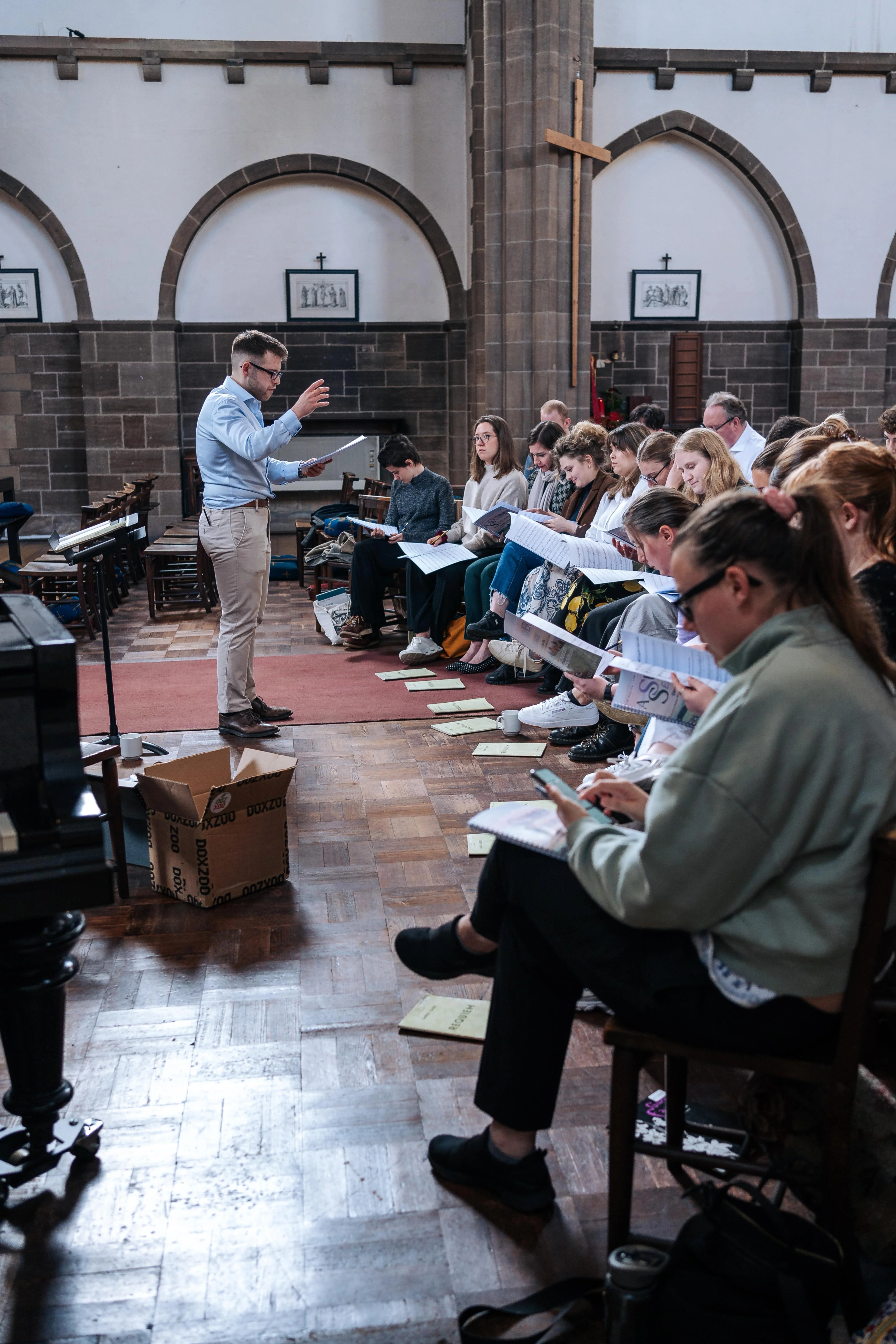 Chris conducting in front of a group 